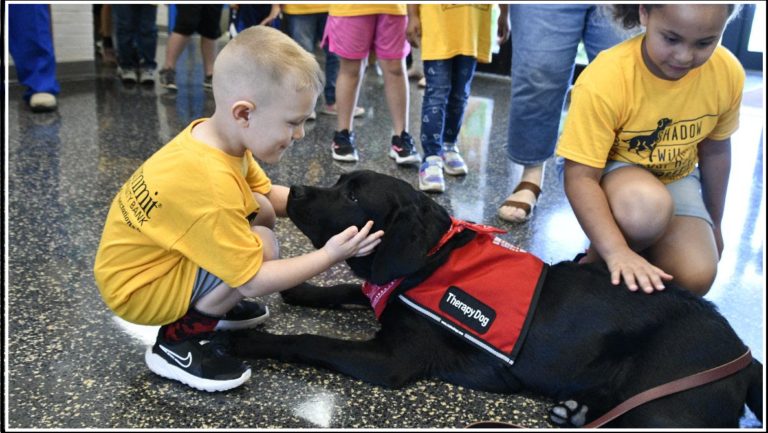 First Woman Equity presents two new Friends Companions with Paws therapy dogs to WV schools